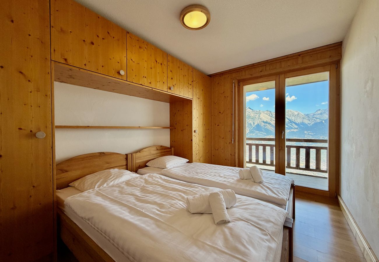 Chambre à coucher Appartement Plein Ciel VA 021, à Veysonnaz en Suisse
