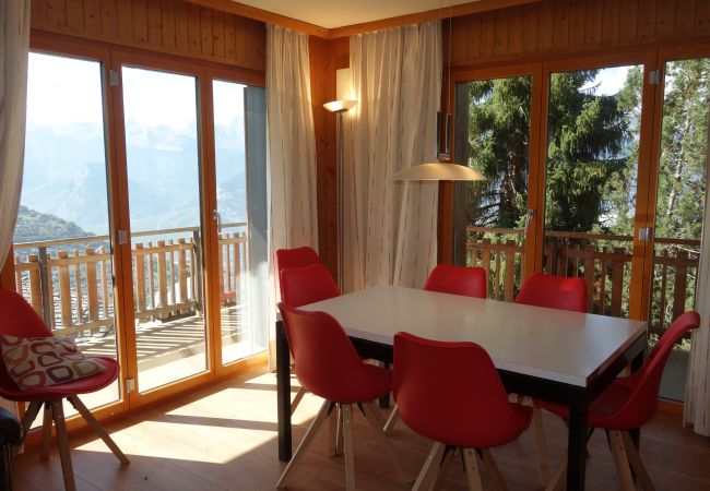 Dining room in flat G 010 in Veysonnaz, Switzerland