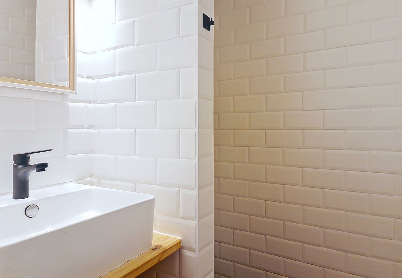 Modern bathroom with walk-in shower and stylish finish